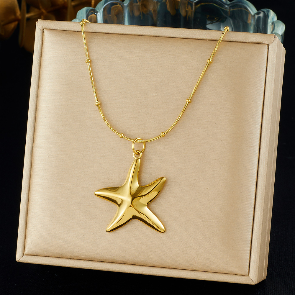 Cross-border fashion gold-plated retro creative multi-element pendant hollow starfish bow flower sun crab necklace