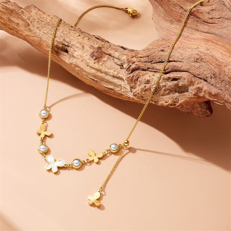 Cross-border fashion retro round pearl polished white mother-of-pearl butterfly accessory pendant tassel chain stainless steel necklace