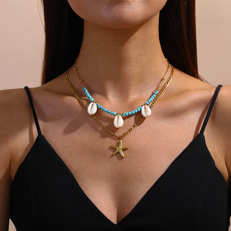 European and American retro oval logo pendant sweatshirt chain, versatile turquoise teardrop imitation pearl angel clavicle chain jewelry.