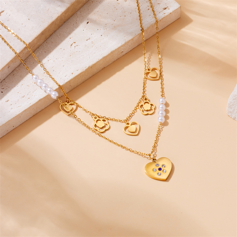 European and American style niche retro high-end gold-plated stainless steel pearl heart eye butterfly pendant multi-layer necklace