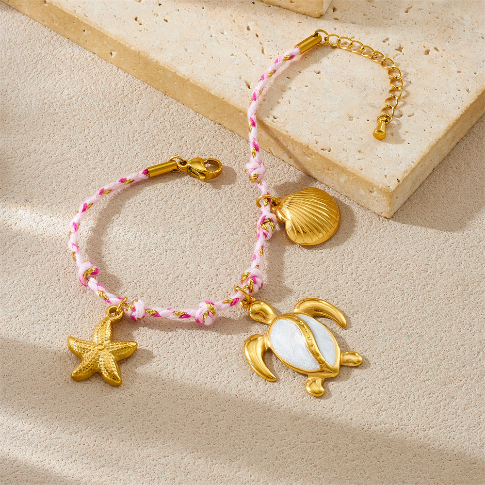 Fashionable, creative, and unique bohemian-style marine life pendant: turtle, starfish, scallop, stainless steel woven bracelet