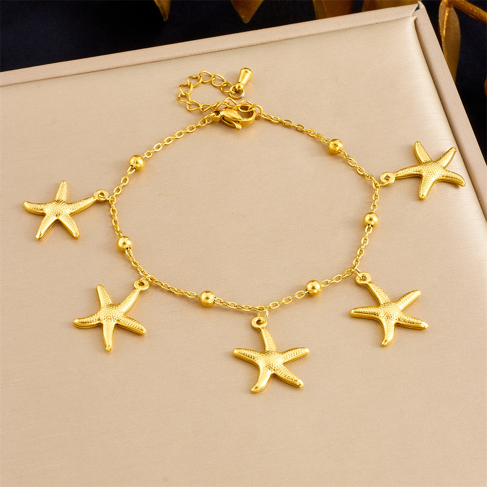Cross-border best-selling summer ocean-themed gold-plated tropical fish, starfish, and scallop stainless steel resort-style premium bracelet