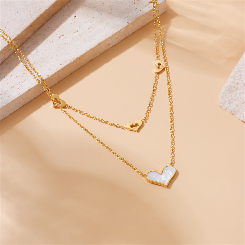 Korean style, fashionable, simple, shell and heart hollowed-out pendant, stainless steel chain, double-layered gold-plated necklace.