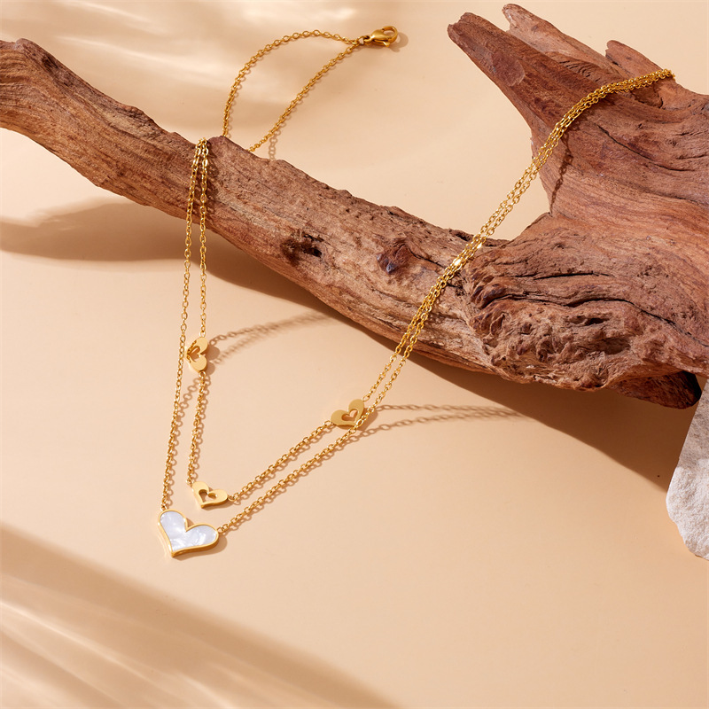 Korean style, fashionable, simple, shell and heart hollowed-out pendant, stainless steel chain, double-layered gold-plated necklace.