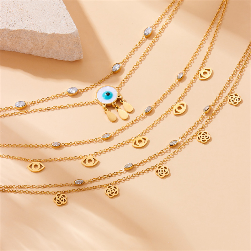 European and American style niche personalized double-layered stainless steel anklet with small flower eyes, teardrop design, rhinestone tassels.