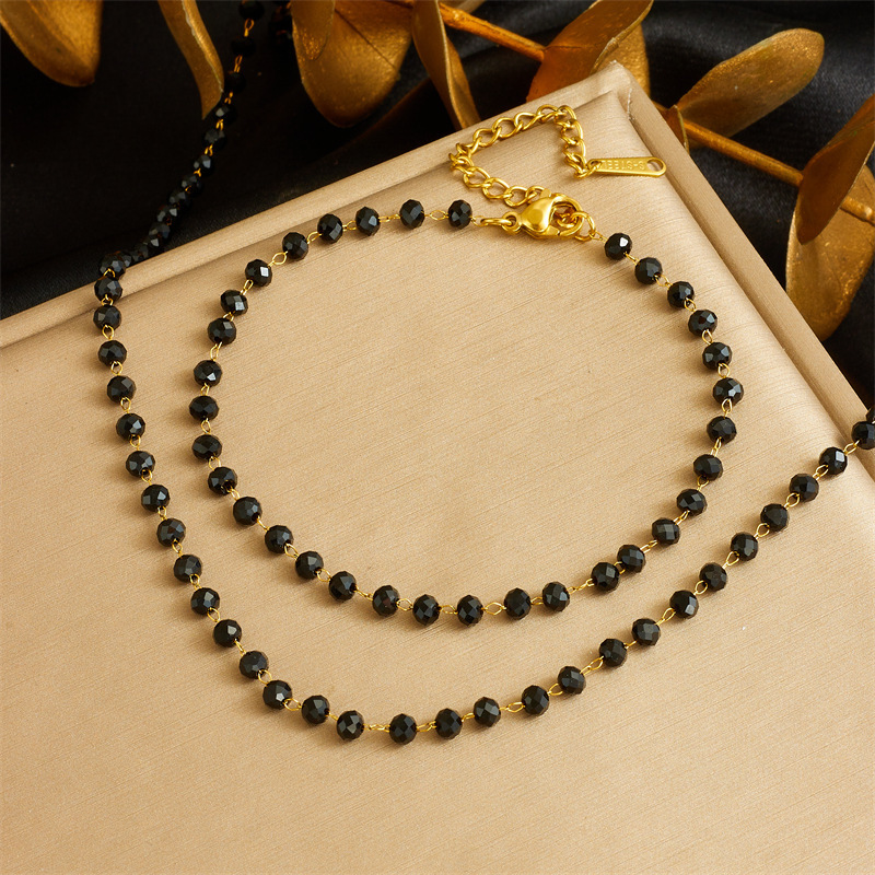 European and American cross-border retro bohemian style stainless steel resin black bead chain necklace and bracelet set for women.