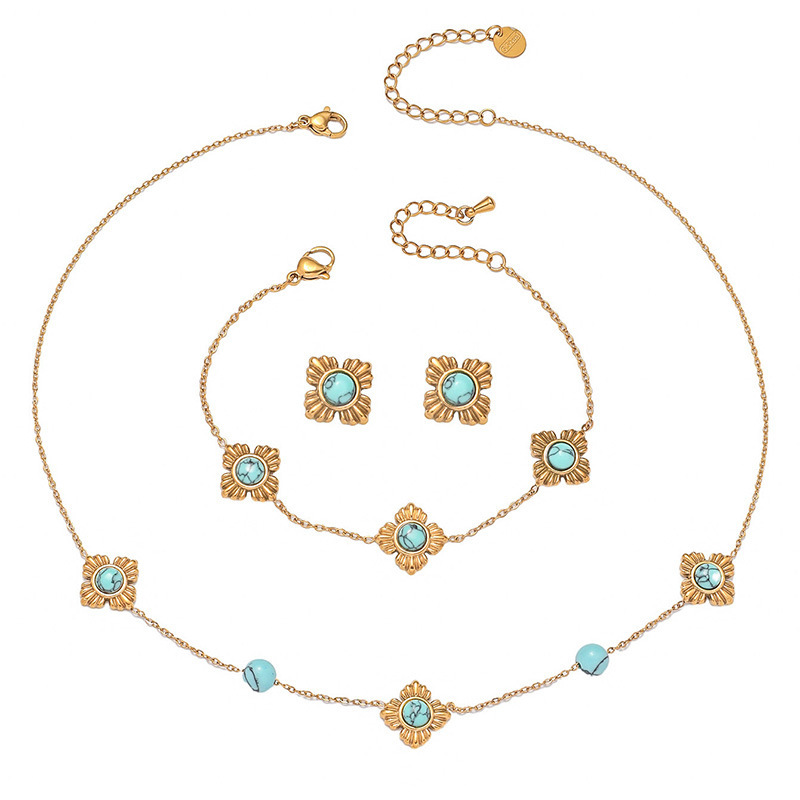 A trendy, modern Chinese-style three-piece stainless steel necklace, earrings, and bracelet set featuring four-petal flower inlay and turquoise.