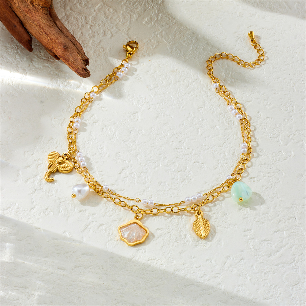 Fashionable new style, unique and fresh, versatile double-layered shell, pearl, elephant, and leaf pendant stainless steel anklet.