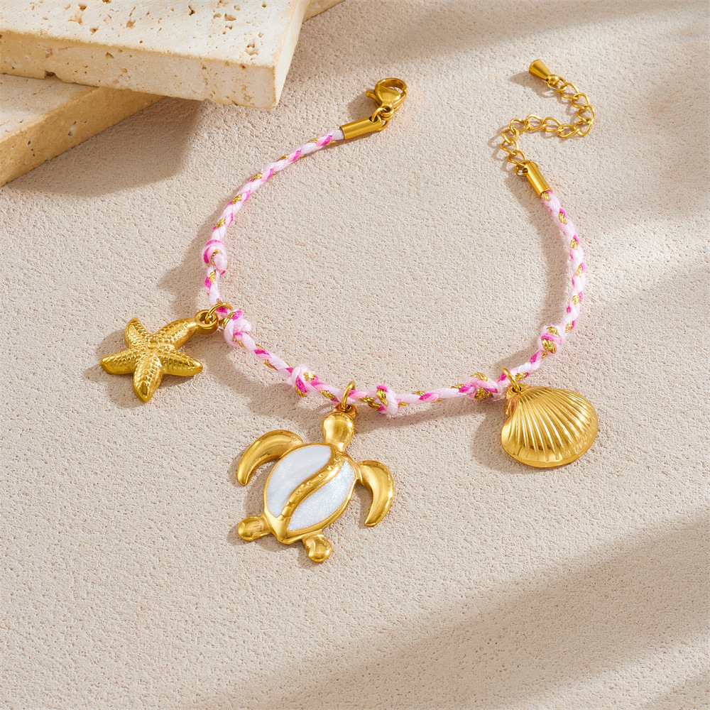 Fashionable, creative, and unique bohemian-style marine life pendant: turtle, starfish, scallop, stainless steel woven bracelet