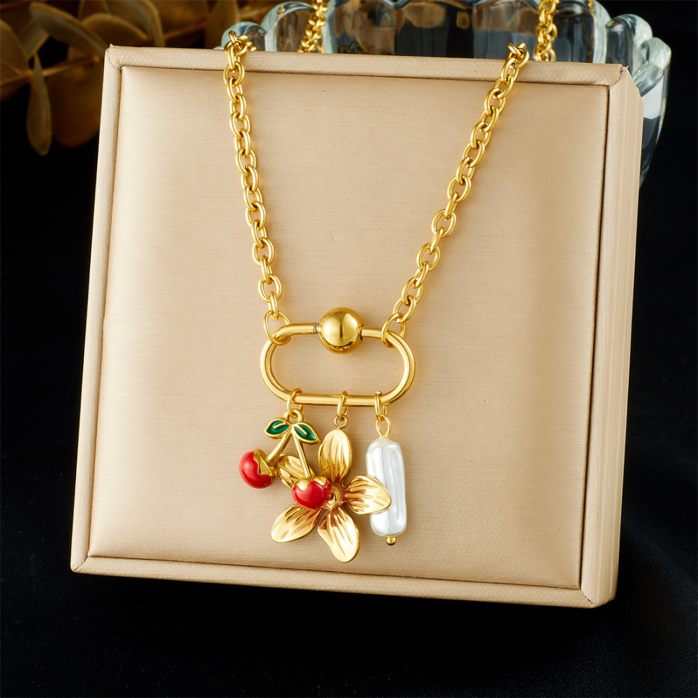 Niche design gold-plated cherry fruit and marine life pendant, gold-plated starfish, seashell, and flower accessory necklace.