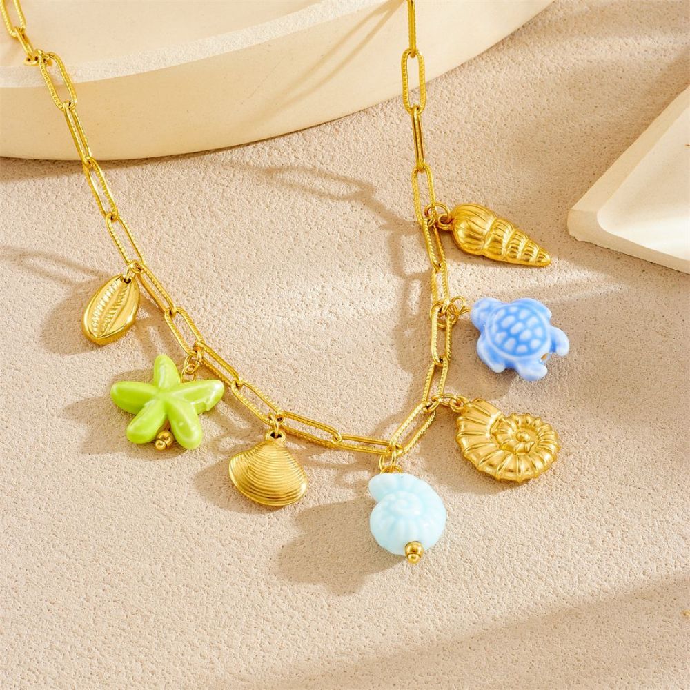 Korean-style fashionable beach vacation style, gold-plated cross chain, seashell pendant, acrylic starfish and turtle necklace.