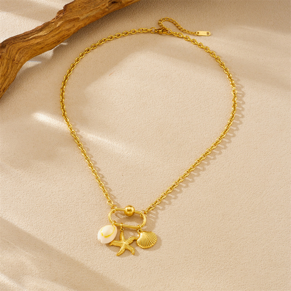 Niche design gold-plated cherry fruit and marine life pendant, gold-plated starfish, seashell, and flower accessory necklace.
