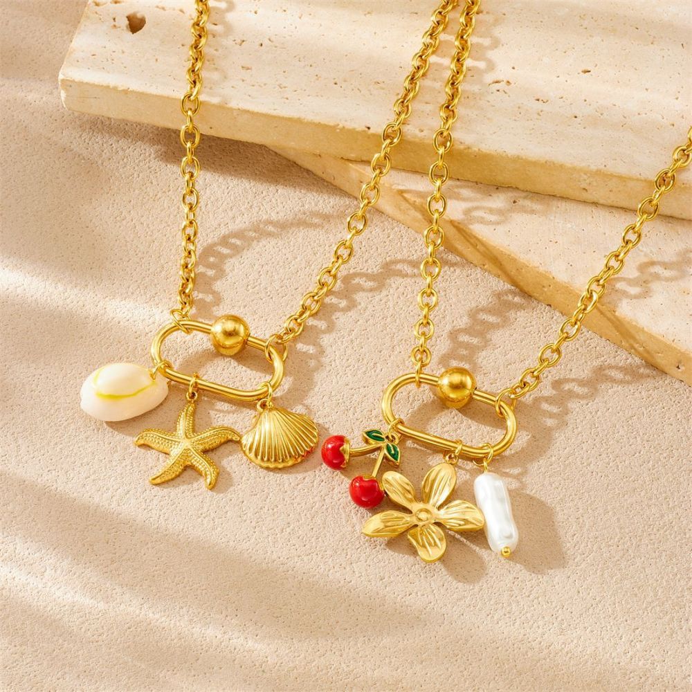 Niche design gold-plated cherry fruit and marine life pendant, gold-plated starfish, seashell, and flower accessory necklace.