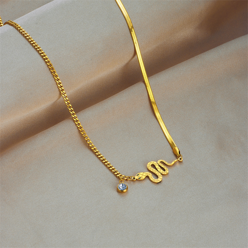 Fashionable, niche, and subtly luxurious design: High-end women's titanium steel bracelet and necklace with gold-plated snake-shaped pendant jewelry set.