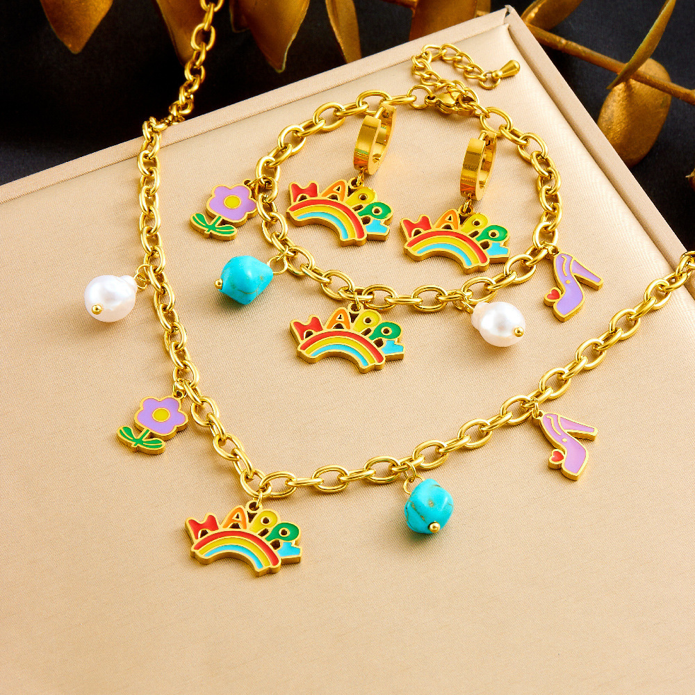 A unique and trendy cute cartoon-style jewelry set featuring a rainbow pendant with turquoise flowers and mixed elements.