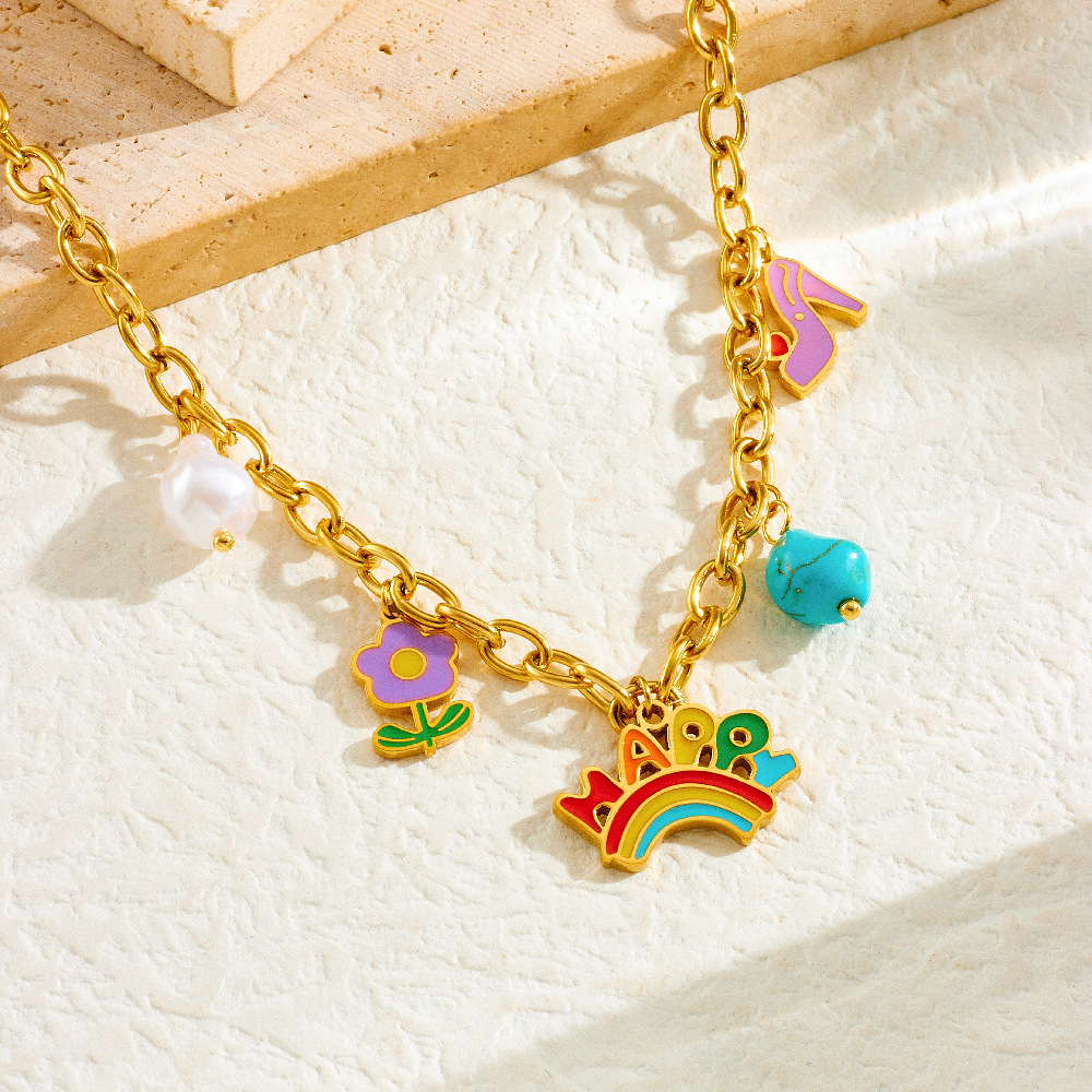 A unique and trendy cute cartoon-style jewelry set featuring a rainbow pendant with turquoise flowers and mixed elements.