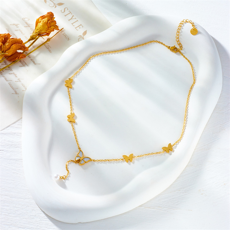 European and American style, simple, light luxury, elegant titanium steel metal chain tassel pearl butterfly pendant necklace.