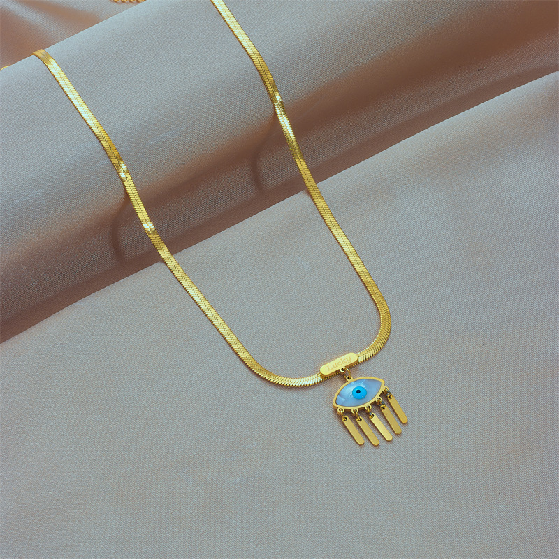 European and American cross-border retro niche fashion high-end U-shaped snake bone chain titanium steel blue eye tassel pendant necklace