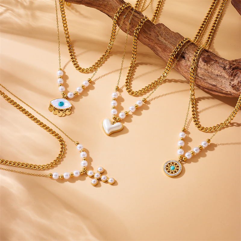 European and American style retro-style double-layer stainless steel necklace with pearl, heart, cross, and eye inlays.