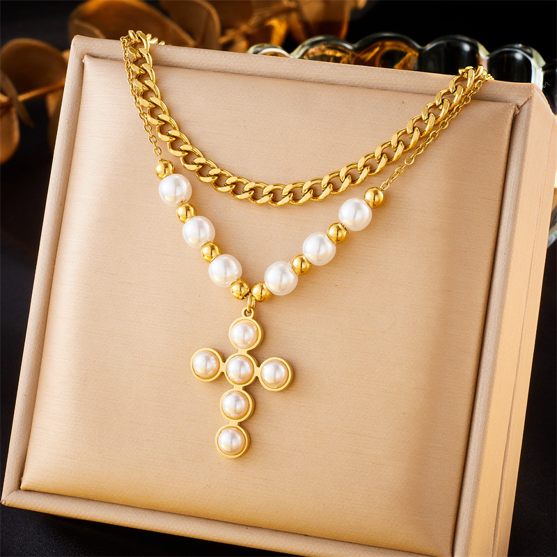 European and American style retro-style double-layer stainless steel necklace with pearl, heart, cross, and eye inlays.