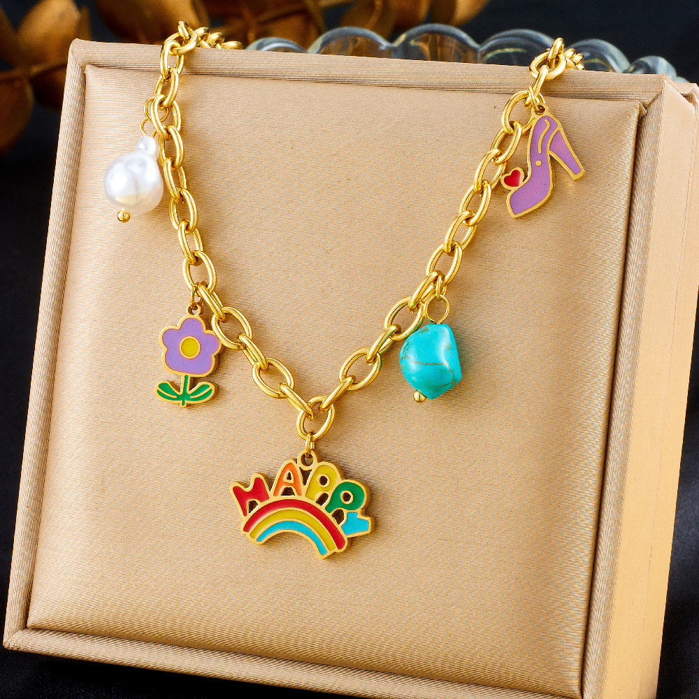 A unique and trendy cute cartoon-style jewelry set featuring a rainbow pendant with turquoise flowers and mixed elements.