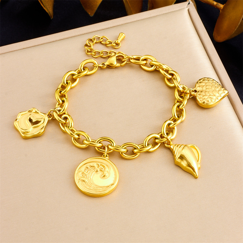 New European and American style gold-plated retro fashion round pendant with wave, conch, and fishtail design, stainless steel jewelry for women's bracelets.