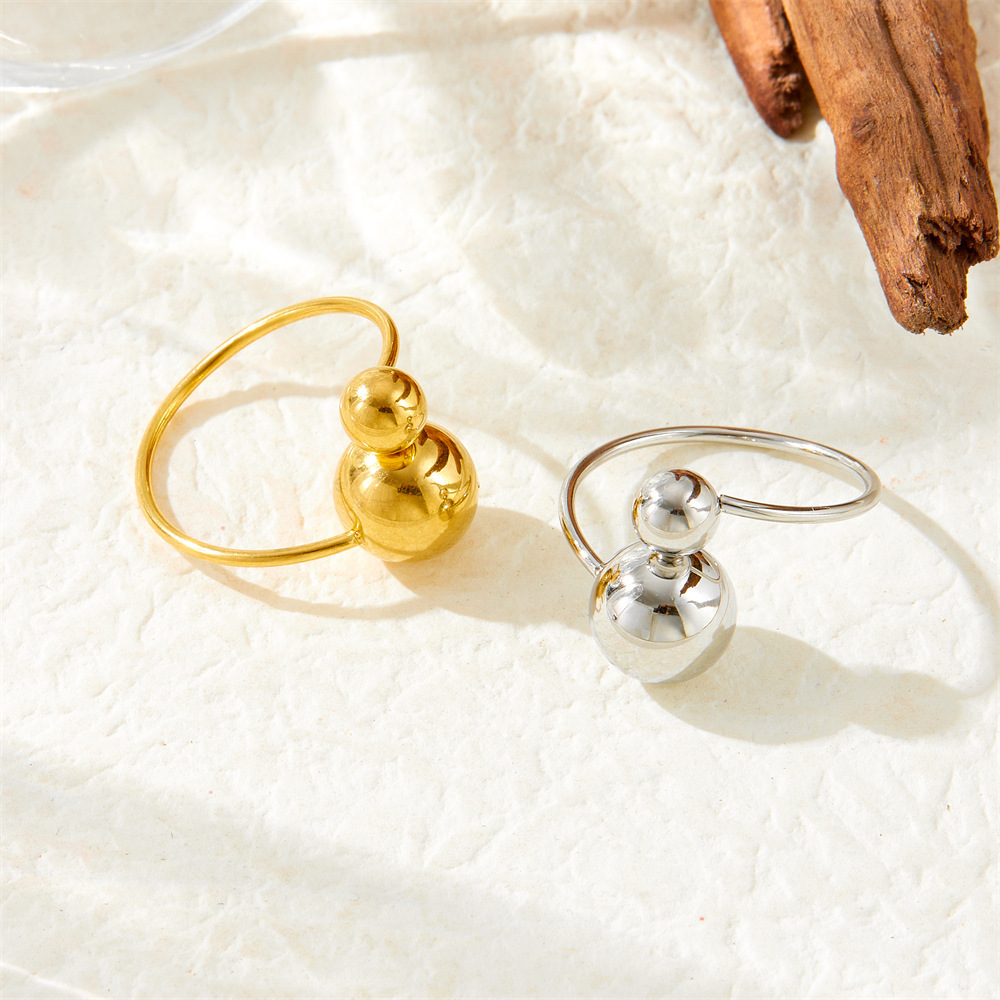 Niche, understated luxury, minimalist style, large and small round, adjustable gold-plated stainless steel thin band women's ring/band.