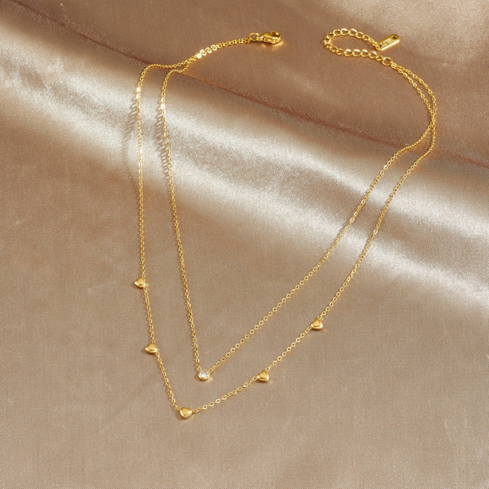 Korean style fashionable and exquisite gold-plated stainless steel double-layered diamond-encrusted heart-shaped pendant necklace, simple and versatile jewelry.