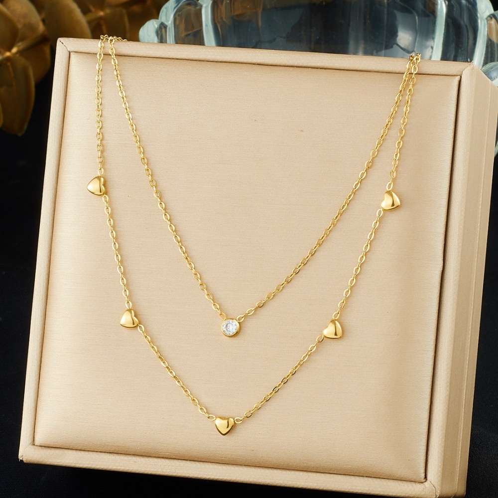 Korean style fashionable and exquisite gold-plated stainless steel double-layered diamond-encrusted heart-shaped pendant necklace, simple and versatile jewelry.