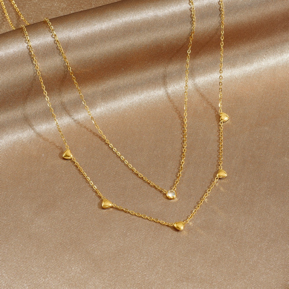 Korean style fashionable and exquisite gold-plated stainless steel double-layered diamond-encrusted heart-shaped pendant necklace, simple and versatile jewelry.