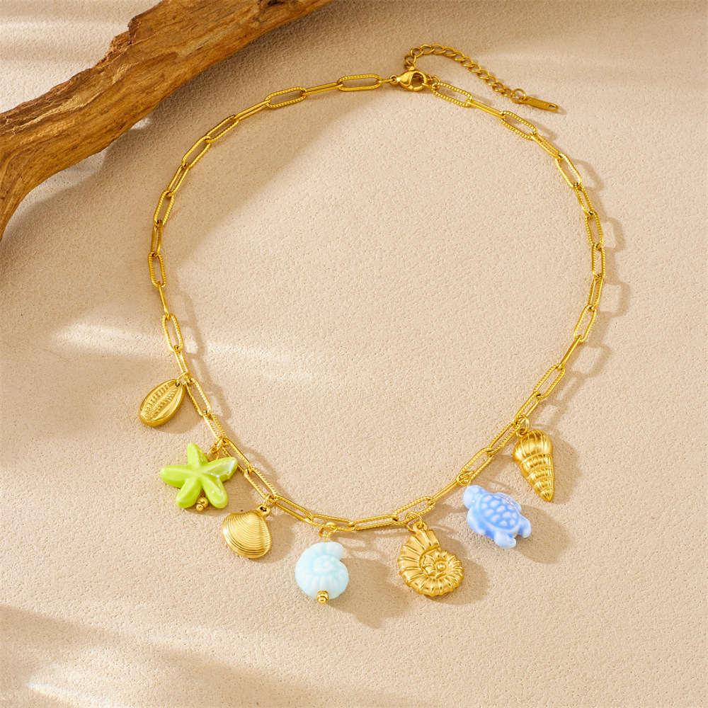Korean-style fashionable beach vacation style, gold-plated cross chain, seashell pendant, acrylic starfish and turtle necklace.
