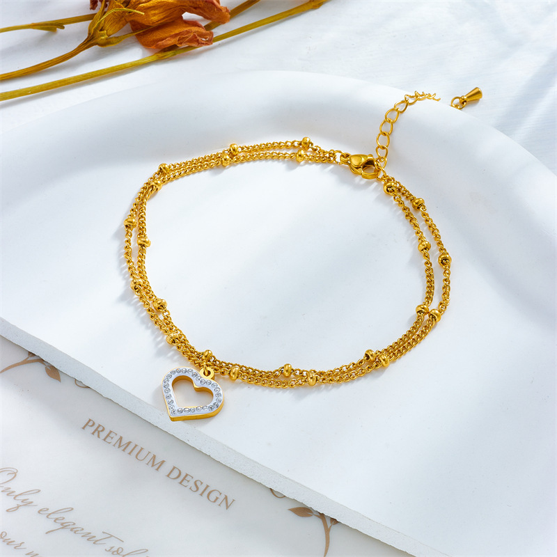 Korean style, fashionable, simple beach-inspired metal beaded double-layer chain with diamond-encrusted heart pendant, titanium steel anklet.