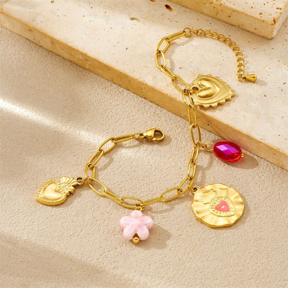 Korean-style fashionable Instagram-inspired multi-element gold-plated round pendant with irregular dripping heart and flower design, stainless steel set.