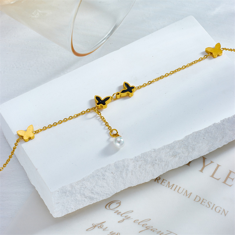 Korean style, fashionable, simple, trendy pearl chain with tassels and butterfly accessories, beach style, metal titanium steel anklet.