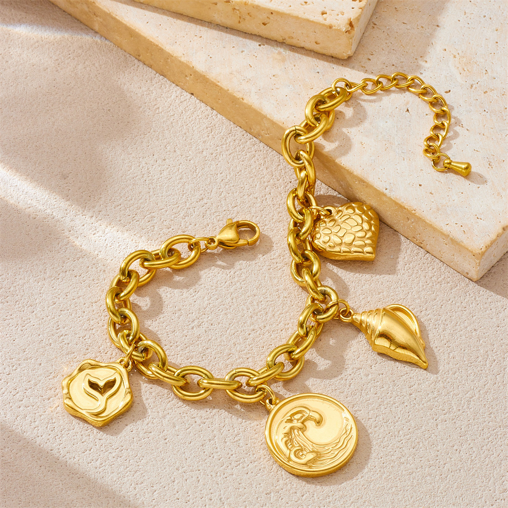 New European and American style gold-plated retro fashion round pendant with wave, conch, and fishtail design, stainless steel jewelry for women's bracelets.