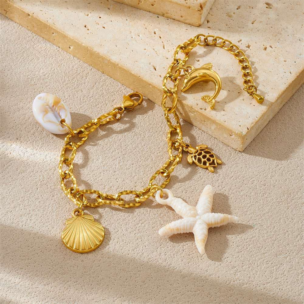 Fashionable, creative, and unique ocean-themed series of starfish, scallop, turtle, and dolphin pendants with chunky chains and stainless steel bracelets.