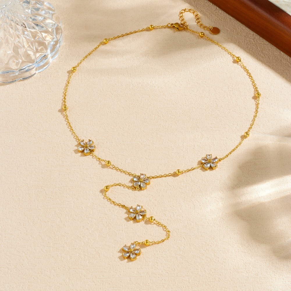 Korean style, fashionable, exquisite, simple, transparent, rhinestone-studded, flower-patterned, long tassel chain stainless steel gold-plated clavicle necklace