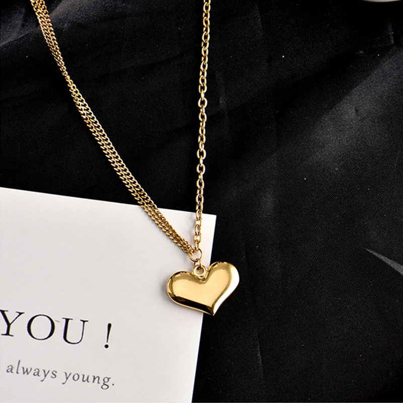 Korean style minimalist asymmetrical titanium steel chain heart-shaped pendant necklace, fashionable, versatile, elegant, and unique clavicle chain.