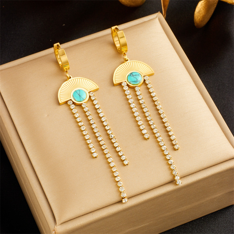 Fashionable, niche, minimalist, elegant, and subtly luxurious round seashell blue eye-shaped diamond chain tassel earrings.