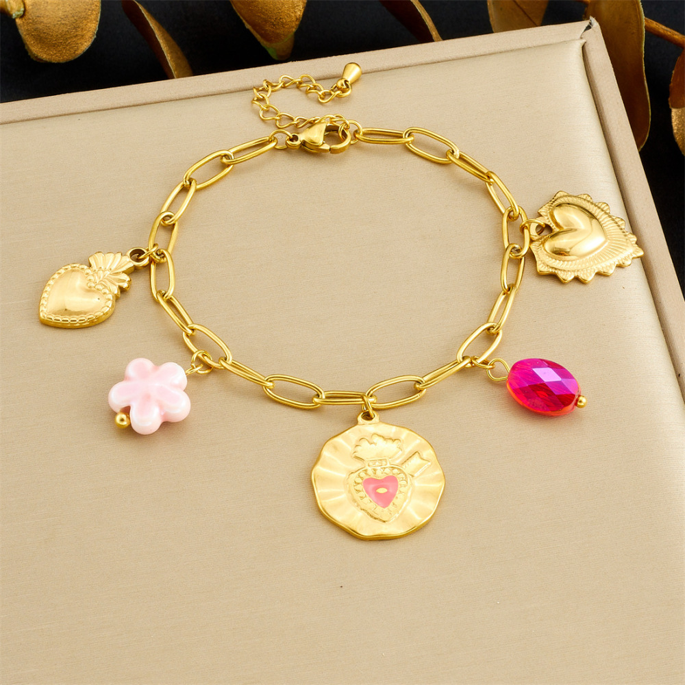 Korean-style fashionable Instagram-inspired multi-element gold-plated round pendant with irregular dripping heart and flower design, stainless steel set.