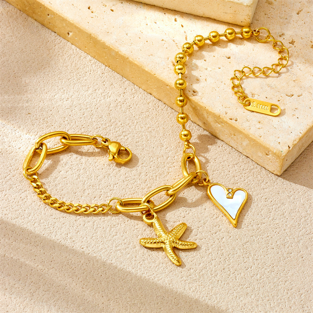 Cross-border European and American stainless steel 18K gold starfish mother-of-pearl heart pendant irregular fashion chain women's bracelet