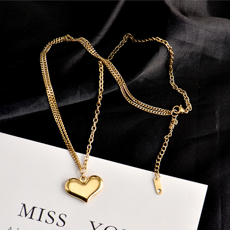 Korean style minimalist asymmetrical titanium steel chain heart-shaped pendant necklace, fashionable, versatile, elegant, and unique clavicle chain.