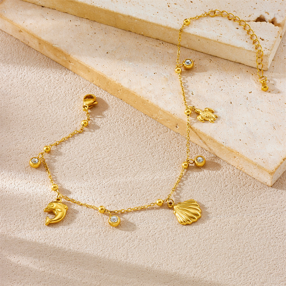 New stylish, simple, and versatile marine life pendant, gold-plated stainless steel turtle, dolphin, scallop chain anklet.