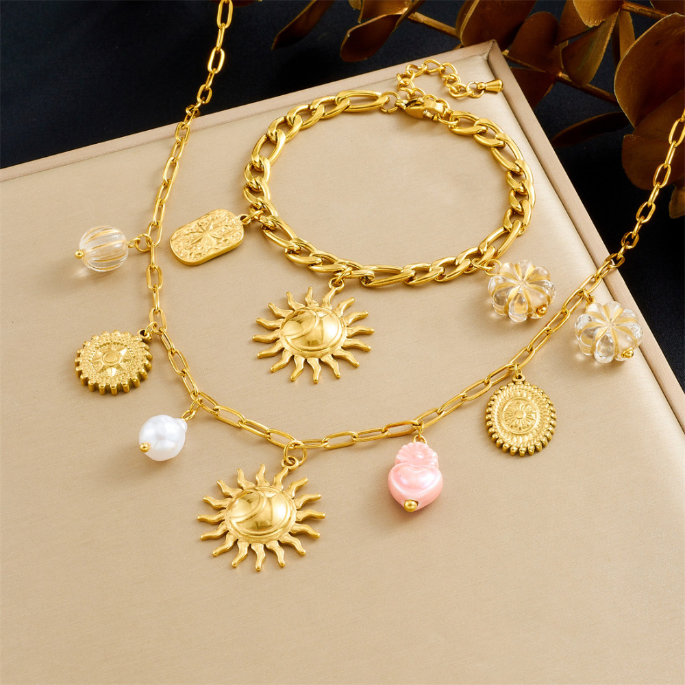 European and American cross-border fashion stainless steel bracelet and necklace set with light luxury retro sun round pendant and heart-shaped pendant for women.