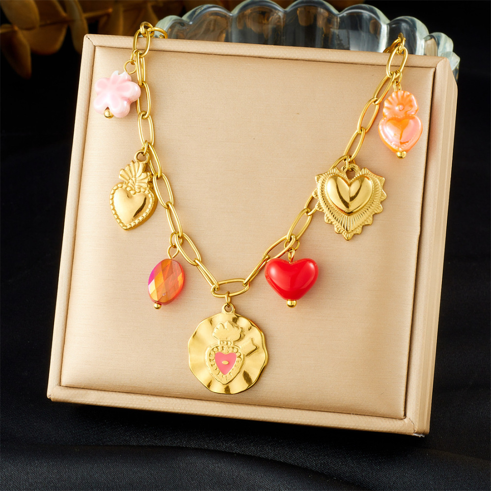 Korean-style fashionable Instagram-inspired multi-element gold-plated round pendant with irregular dripping heart and flower design, stainless steel set.