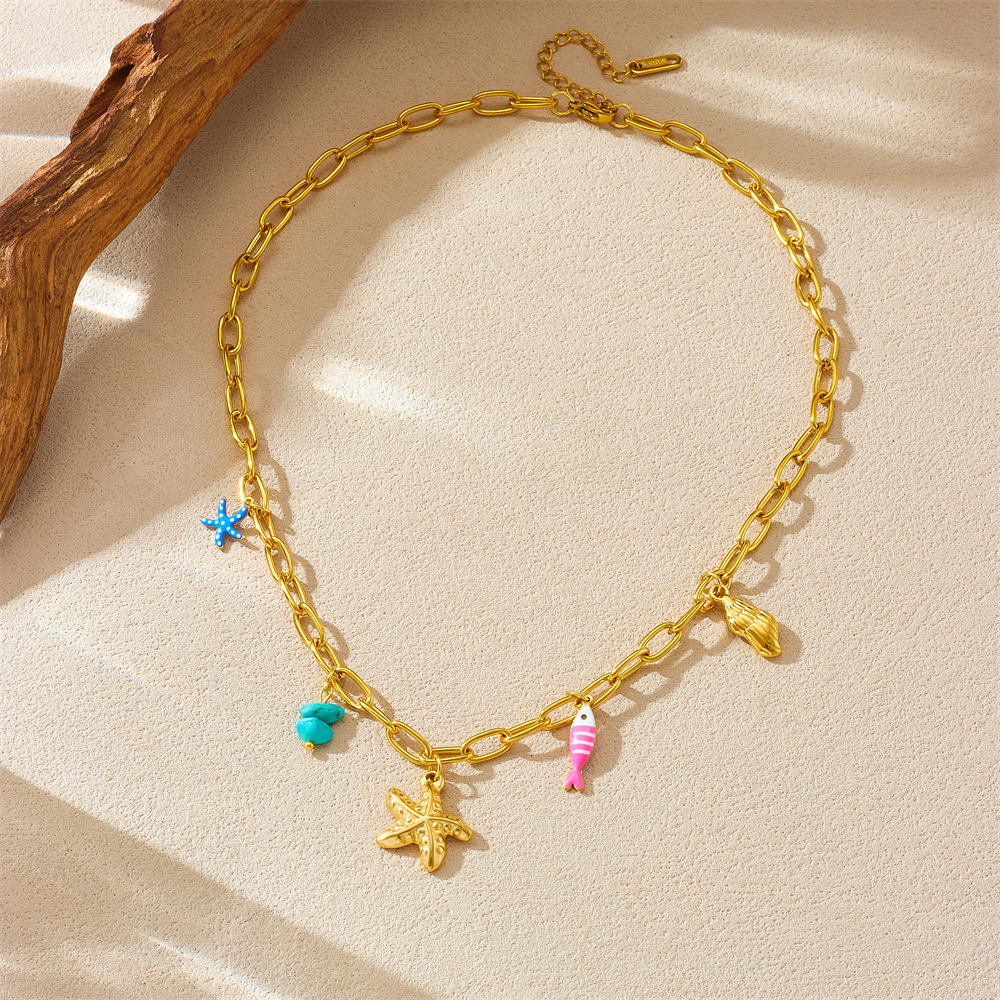 New cross-border fashion multi-element pendant necklace featuring marine life, conch, oil droplets, striped fish, polka dot starfish.
