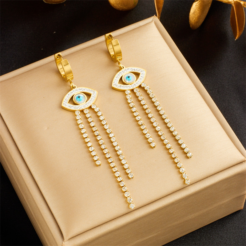 Fashionable, niche, minimalist, elegant, and subtly luxurious round seashell blue eye-shaped diamond chain tassel earrings.
