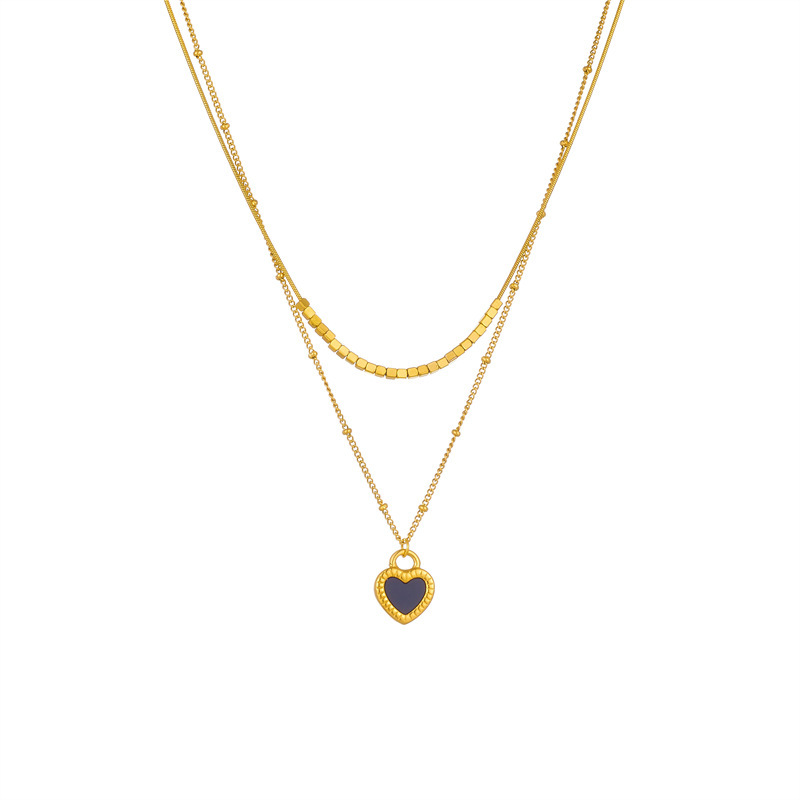 European and American style, simple and versatile, heart-shaped gold-plated titanium steel double-layer chain necklace with black and white heart pendant.
