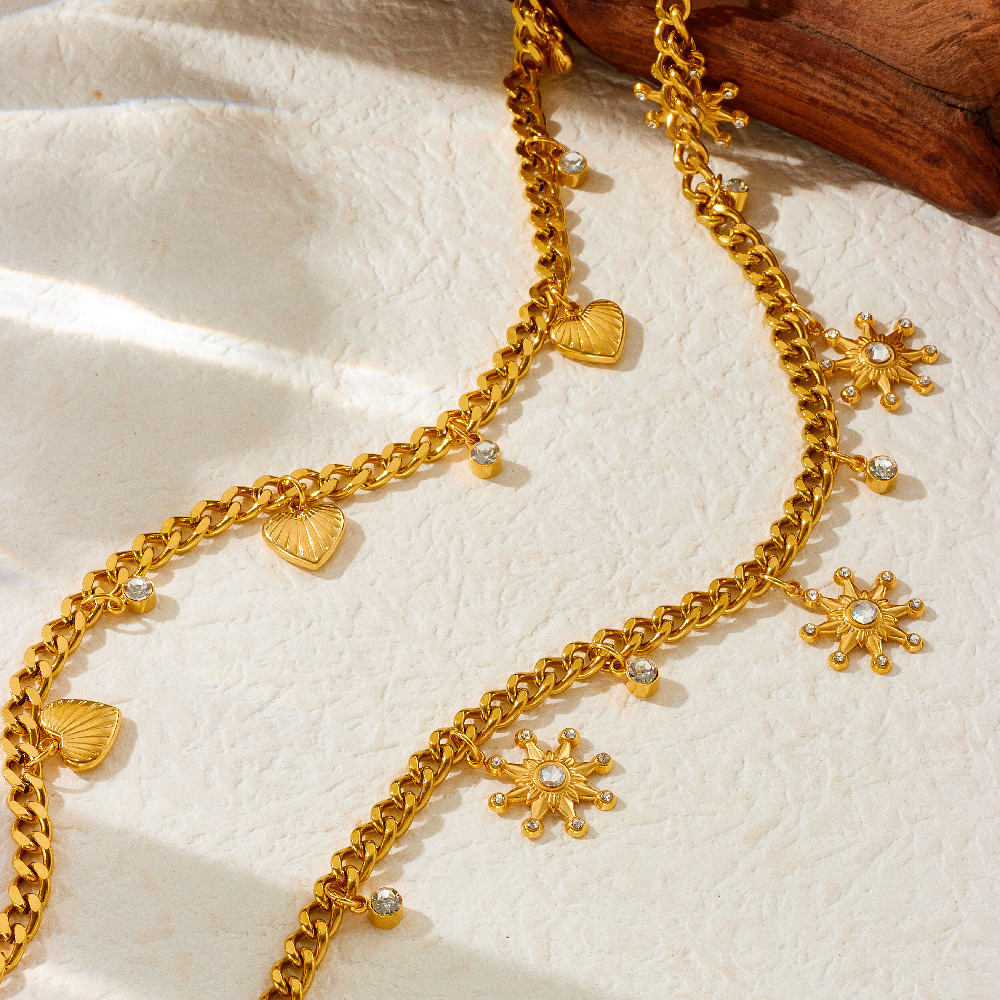 Fashionable and unique resort-style ocean-themed necklace with dripping dolphin, pearl, seashell, and starfish design, featuring a chunky stainless steel chain.