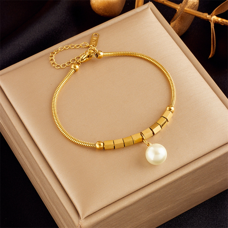 Stylish, sophisticated, niche design, understated luxury, versatile gold-plated butterfly, pearl, flower, and diamond-encrusted bracelet.